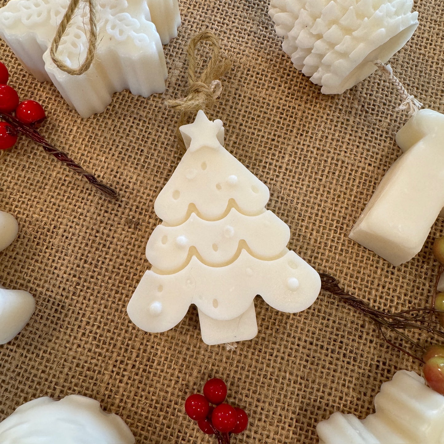 mini Christmas tree candle on hessian sheet