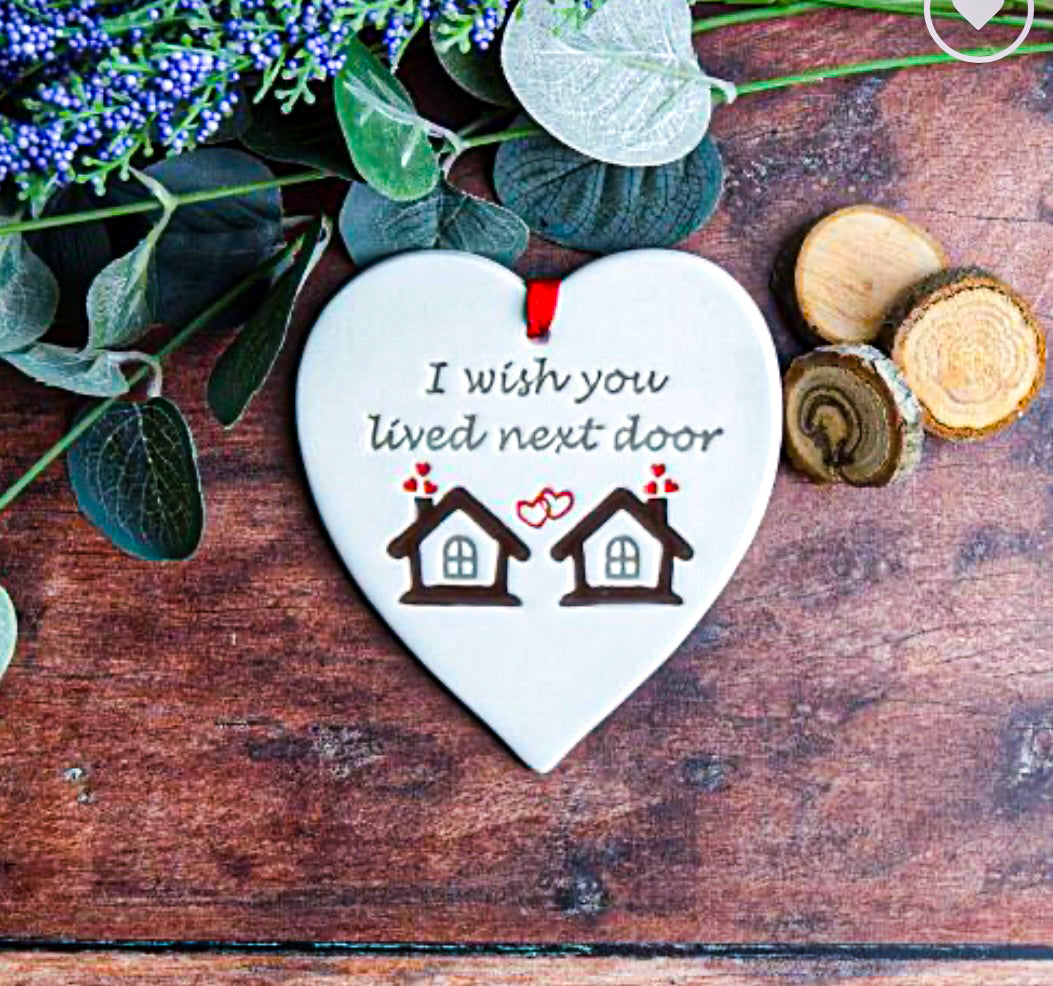 NextDoor Ceramic Gift. Tag with the text, "I wish you lived next door" with foliage around