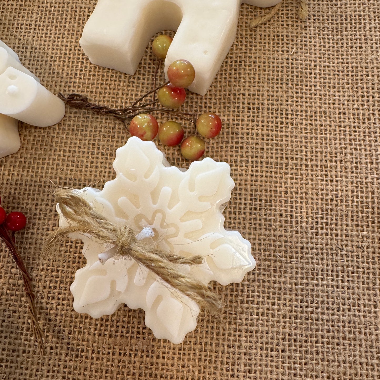 mini Christmas candle snowflake on hessian sheet