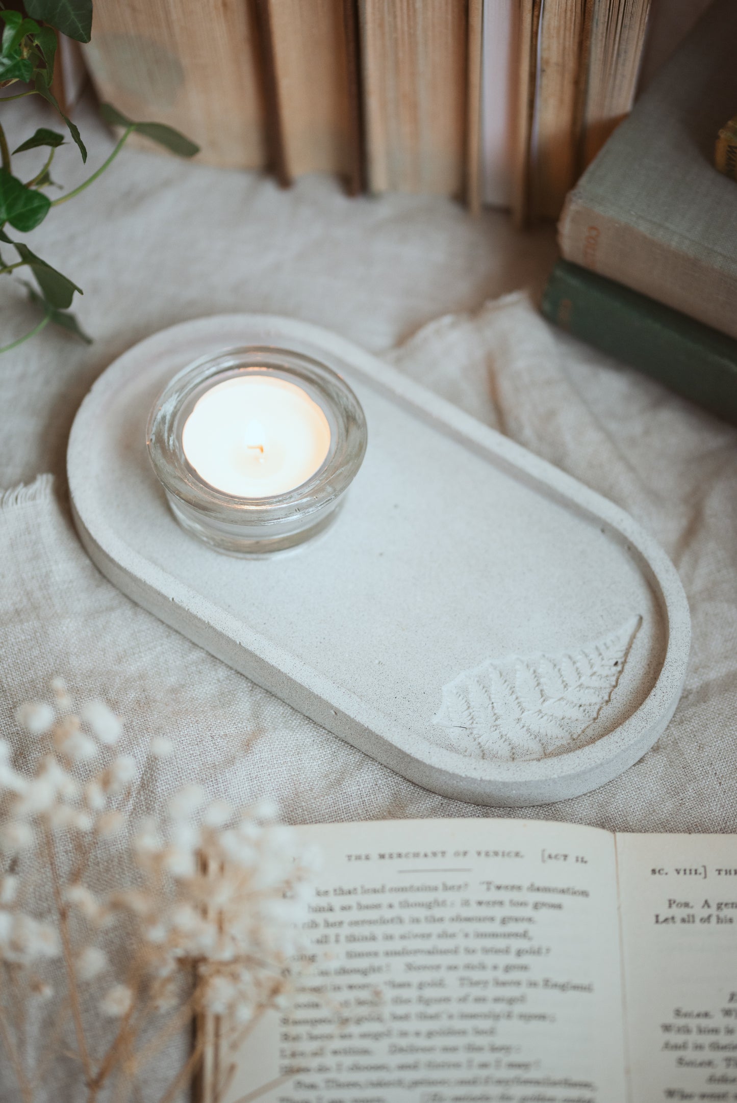 Oval Jesmonite dish with a leaf pattern, tea light on tray