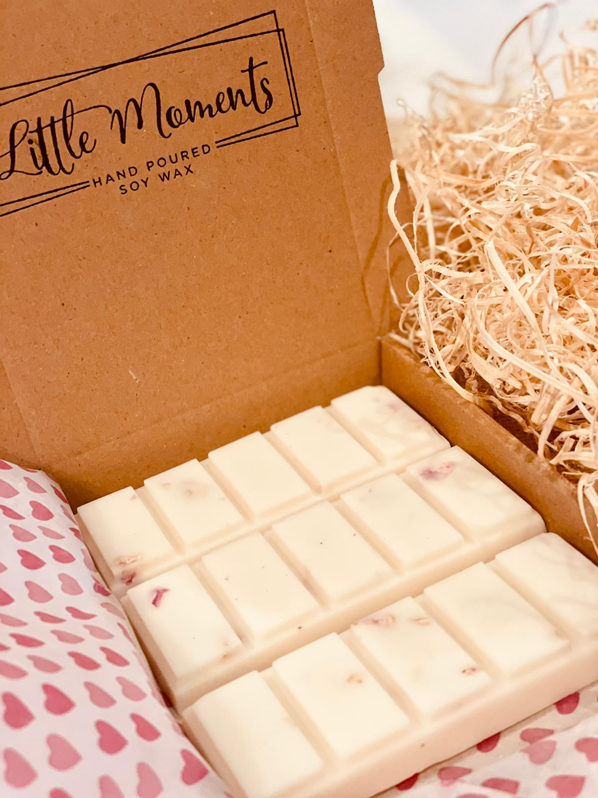 postal box containing three hand poured soy wax melt bars in various fragrances