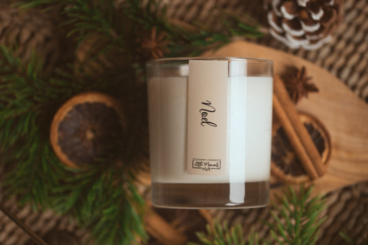 Noel candle lay in Christmas setting 