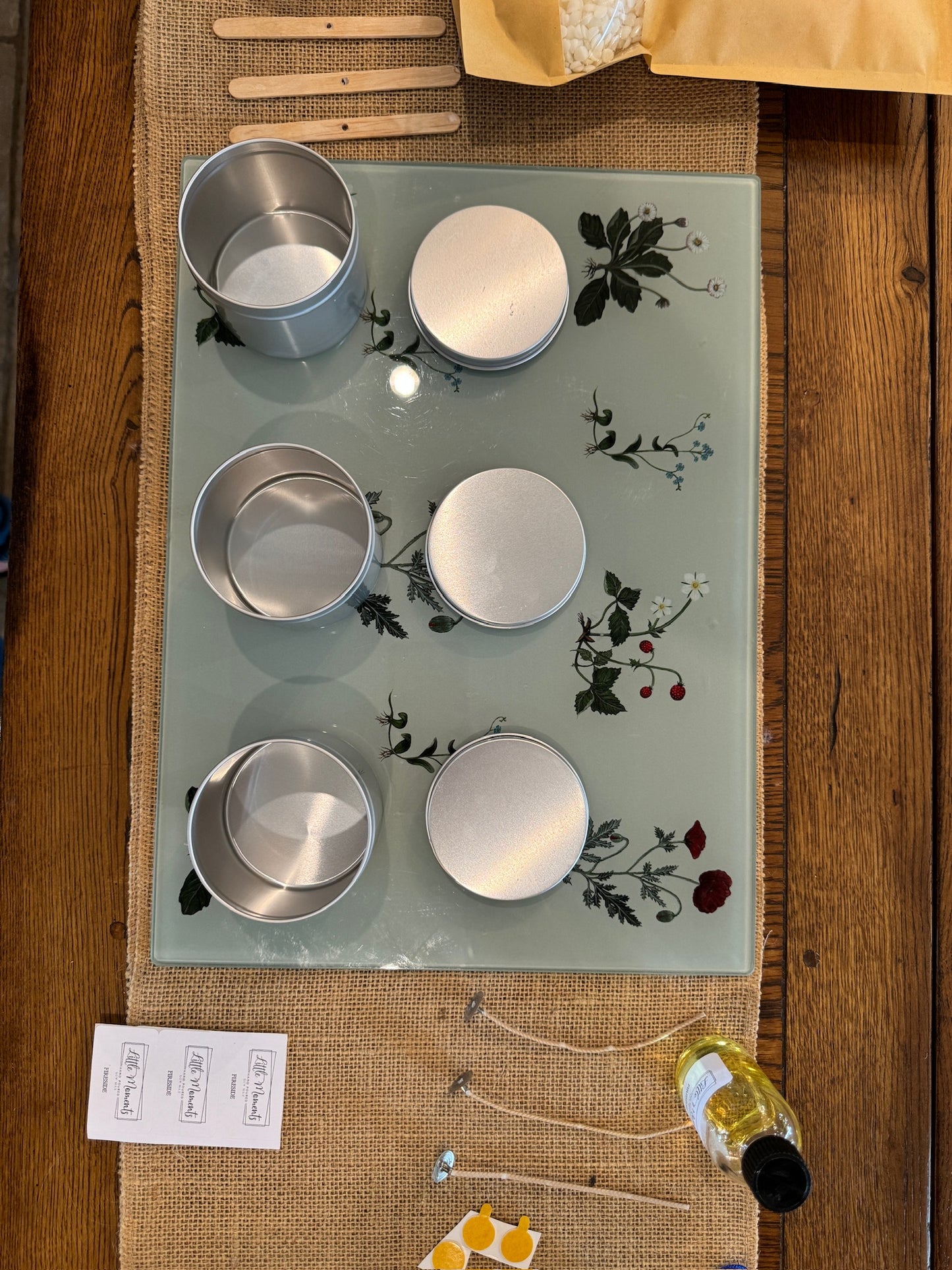 equipment for candle making including 3  tins to house the candles , wicks, dried flowers  and labels 