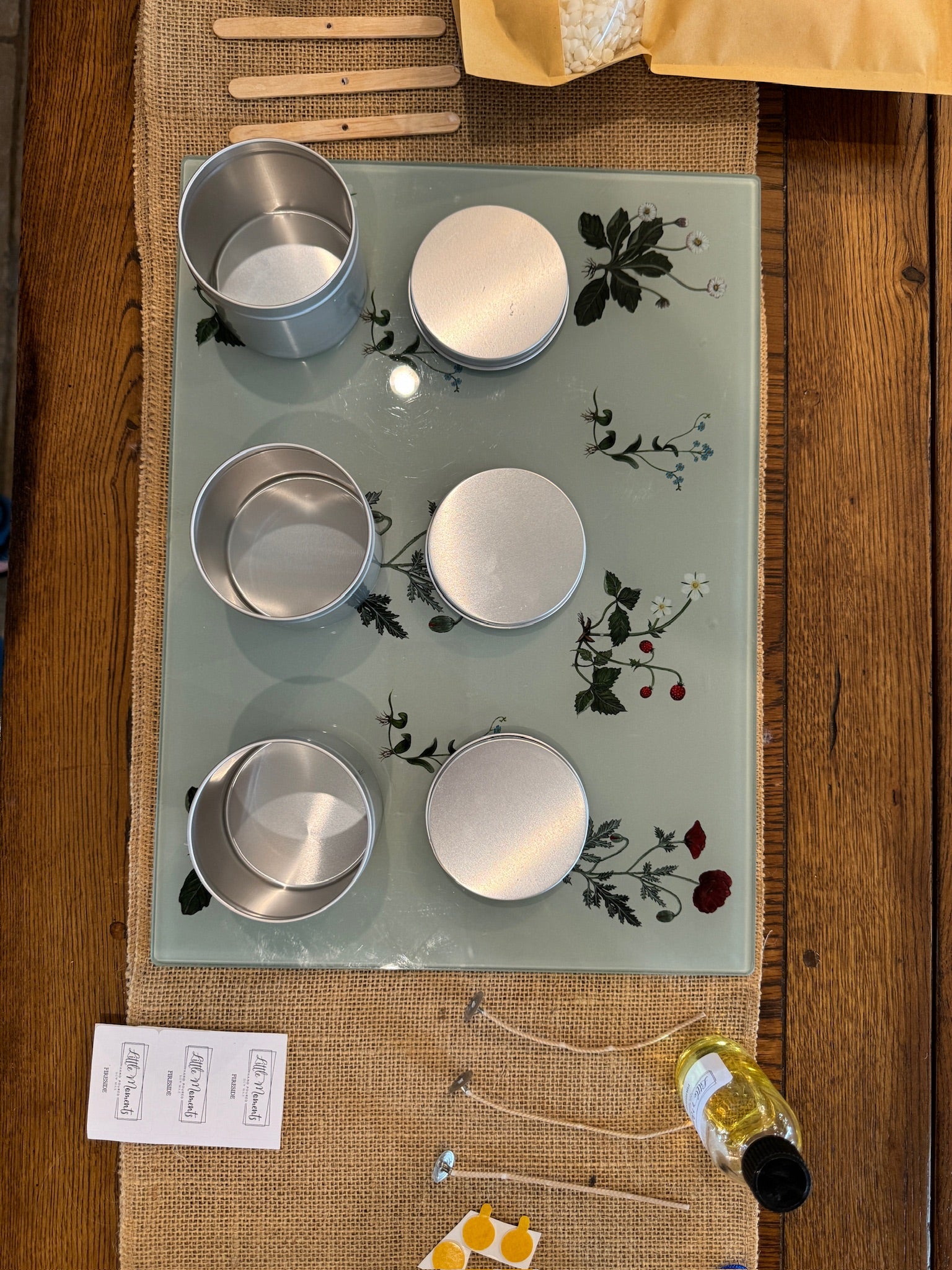 equipment for candle making including 3  tins to house the candles , wicks, dried flowers  and labels 