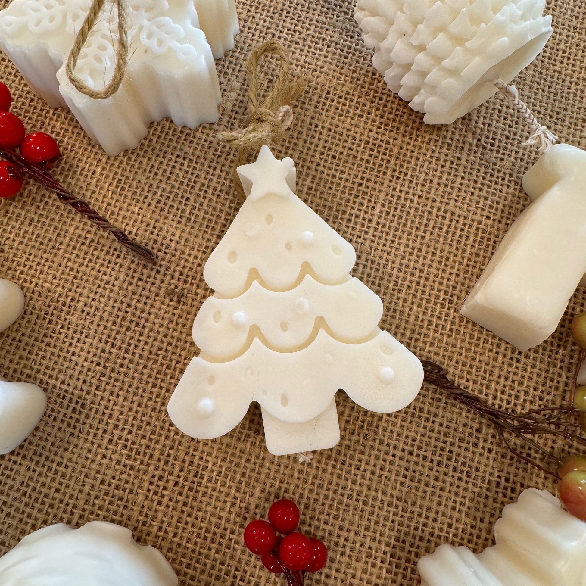 mini Christmas  tree candle on hessian sheet 