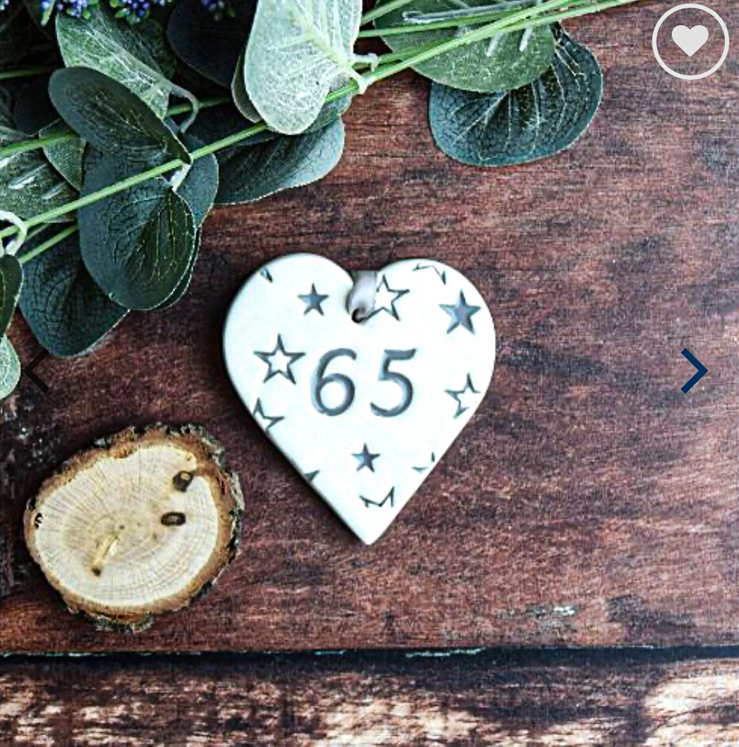 ceramic gift tag with the text "65"  surrounded by blue stars 