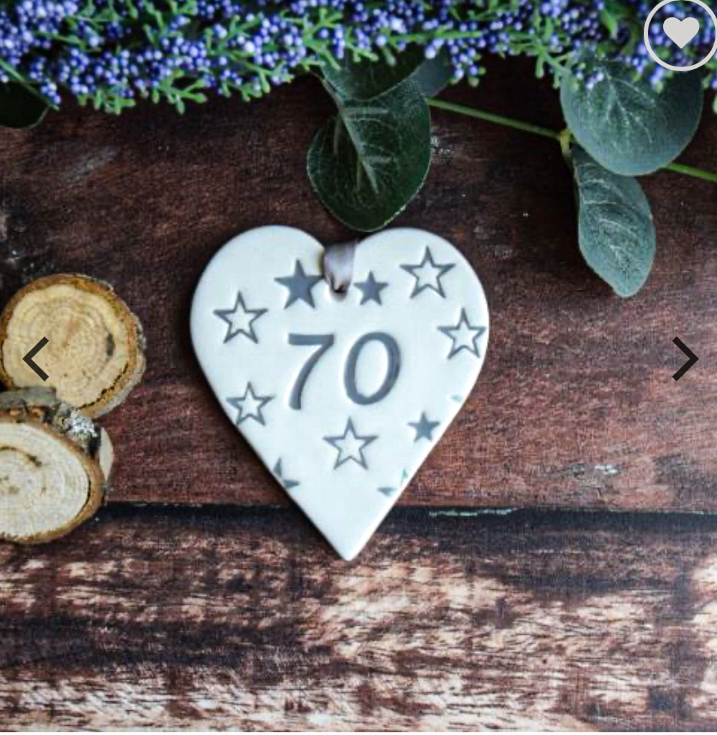 ceramic gift tag with the text "70" and surround by grey stars 