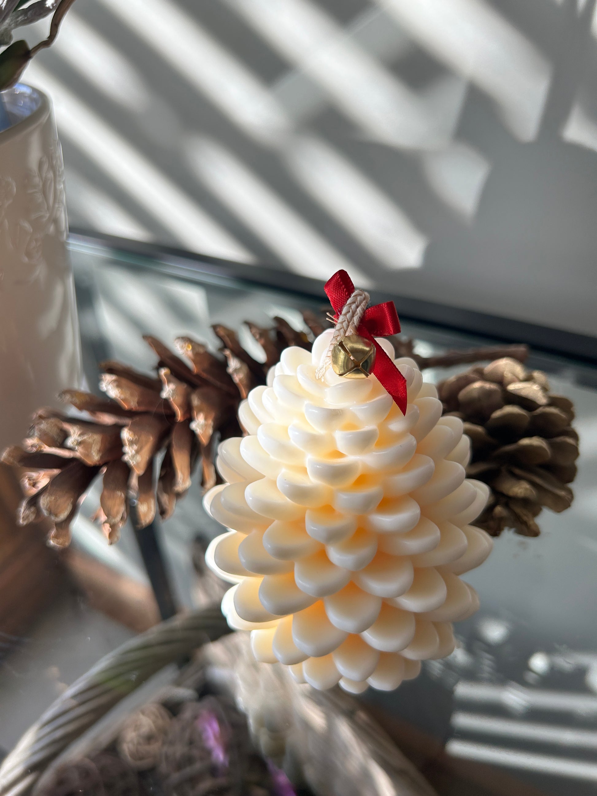 white fir cone shaped candle