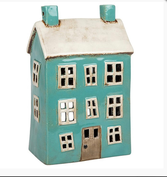 Green ceramic house with white roof and white windows, the windows are cutout blanks 
