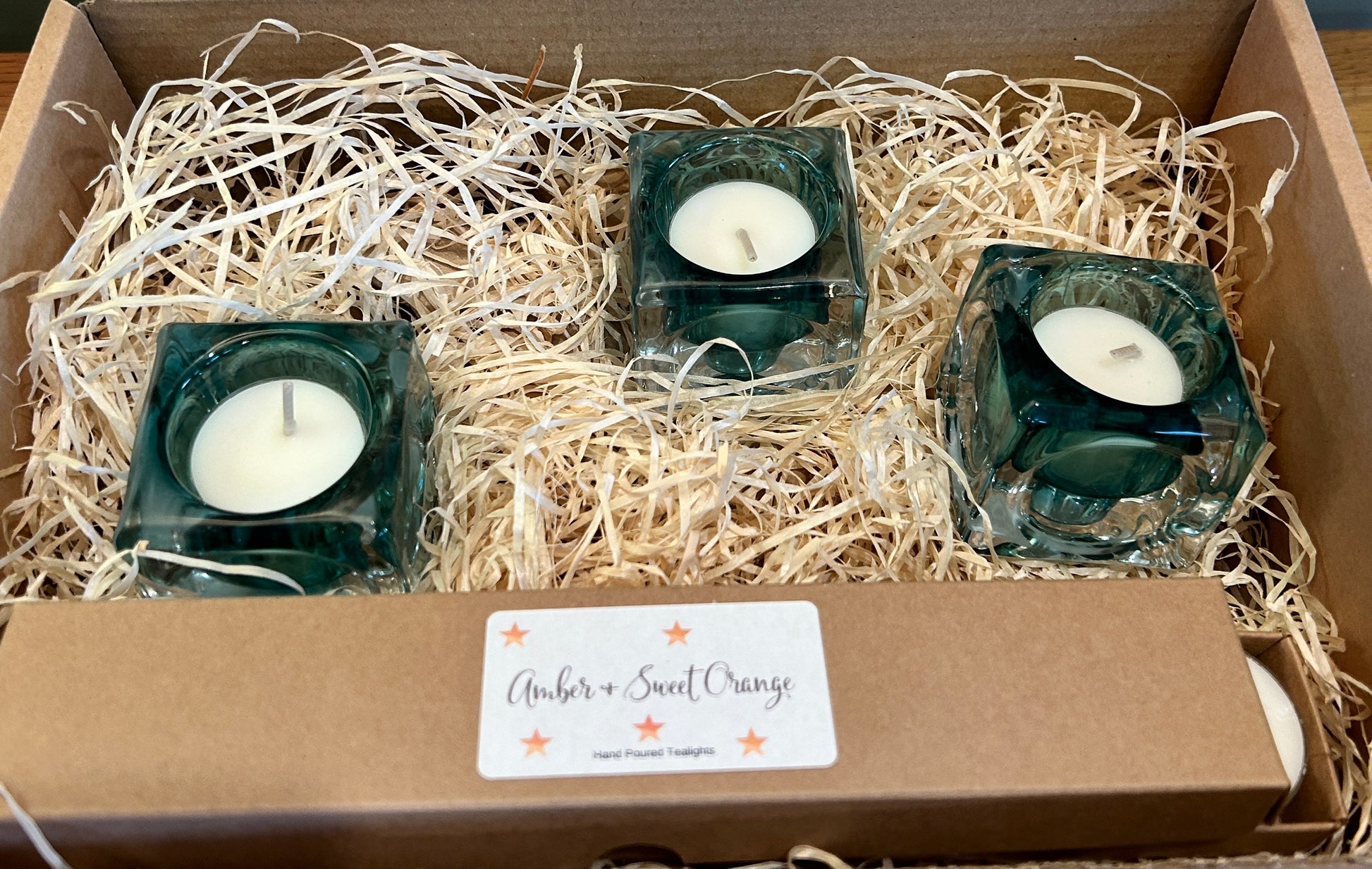 3 x blue  square  glass  Tealight holders in shredded wooden packaging 