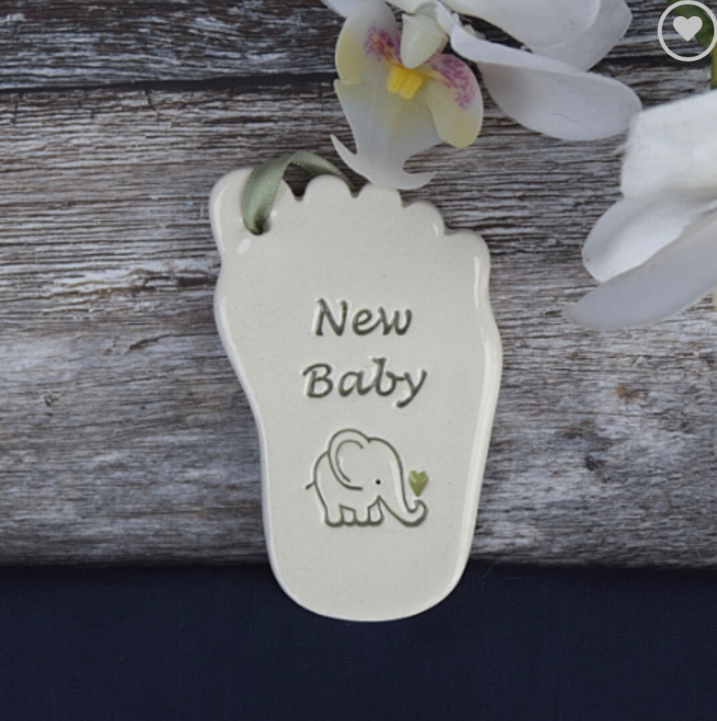 Ceramic tag in the shape of a babies foot with the words "new baby" and elephant drawing , a perfect  gift for a baby shower