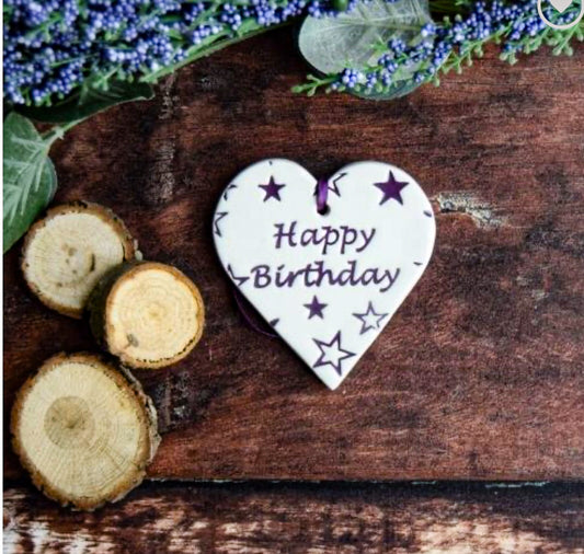 Ceramic Gift tag with the text "happy birthday' and stars 