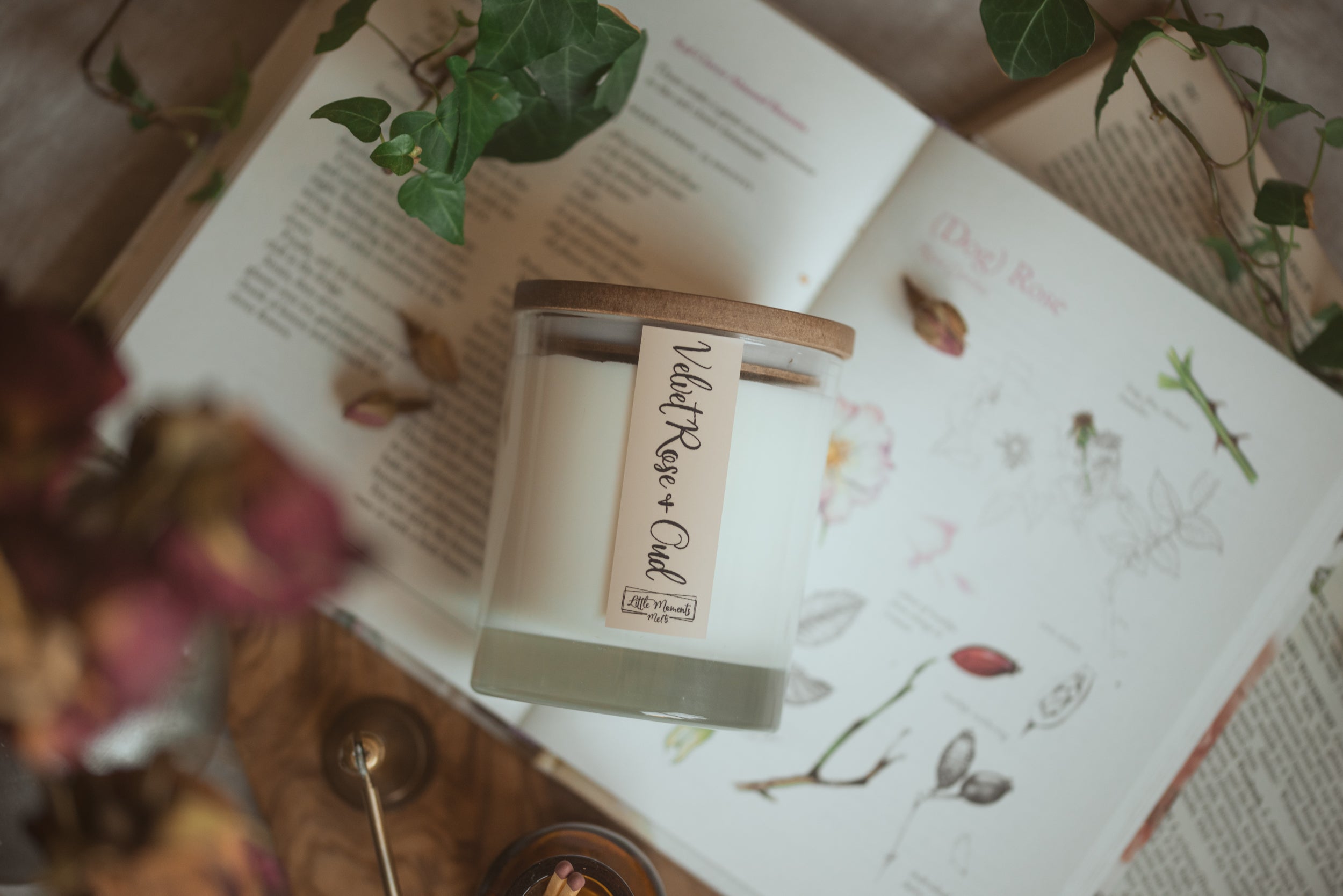 Luxury hand-poured soy candles and sculptural wax melts displayed in a cozy, styled setting