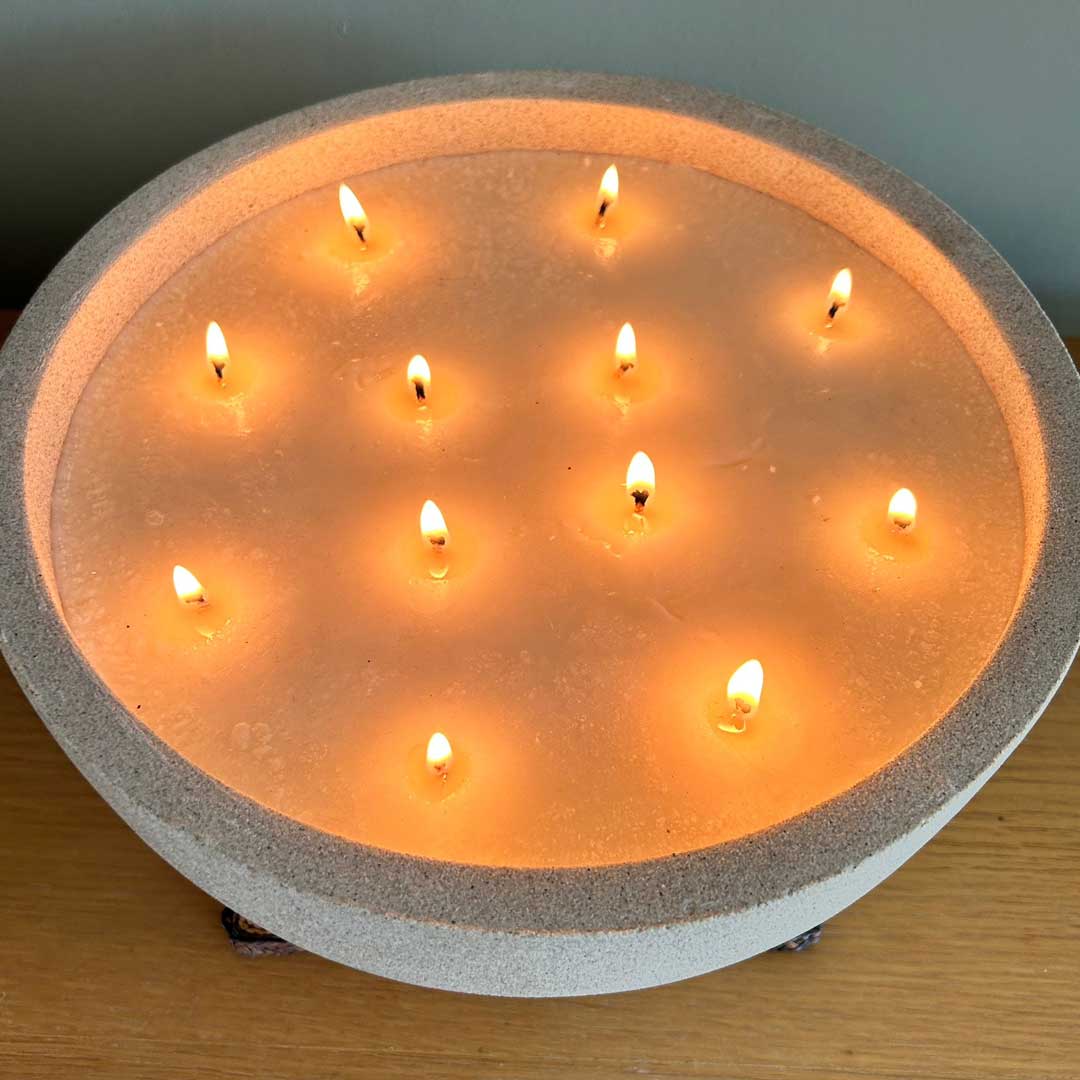 Lit extra large bowl candle with 12 wicks all lit 