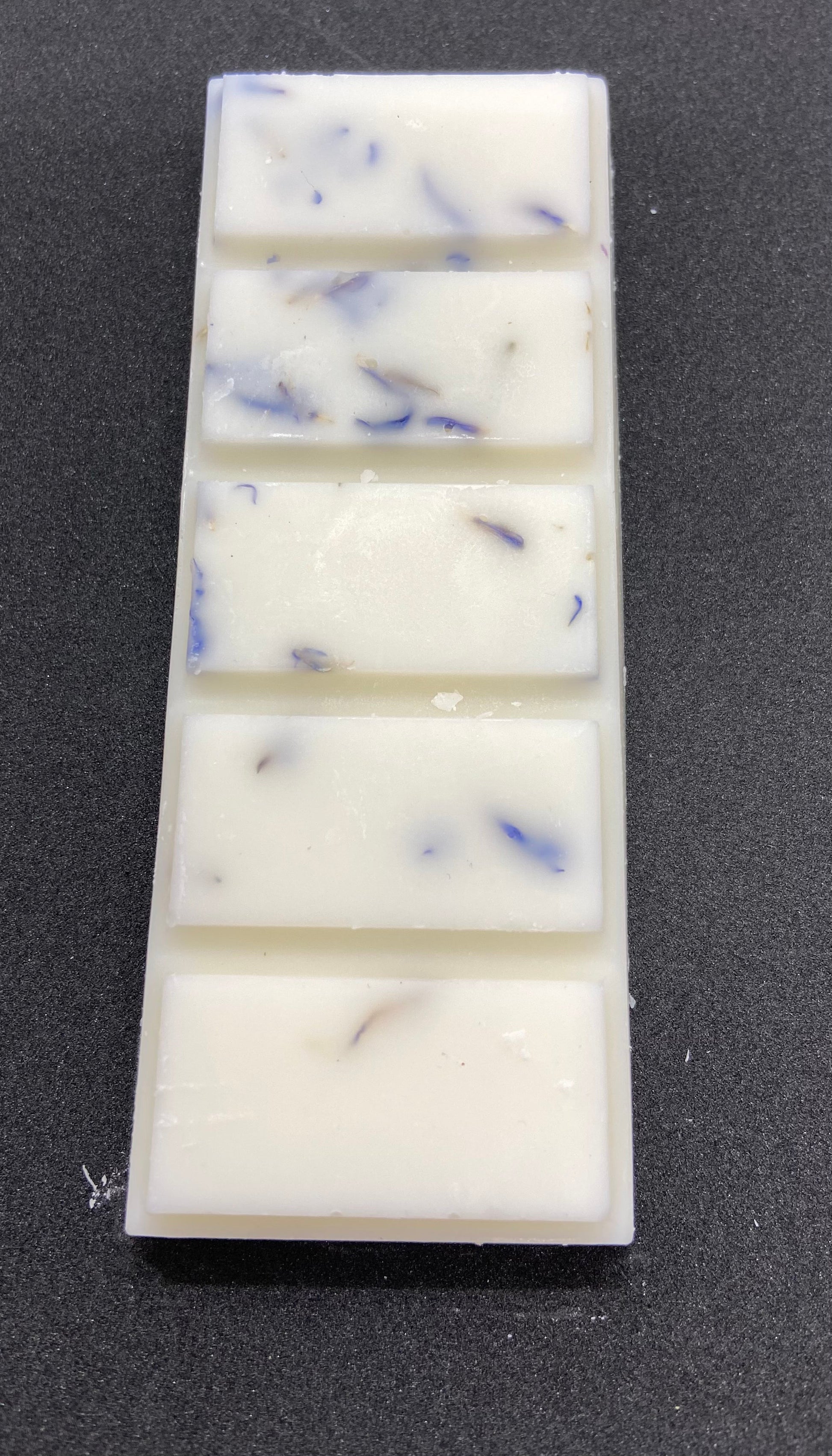hand poured soy wax melt bar with flecks of lavender inside 