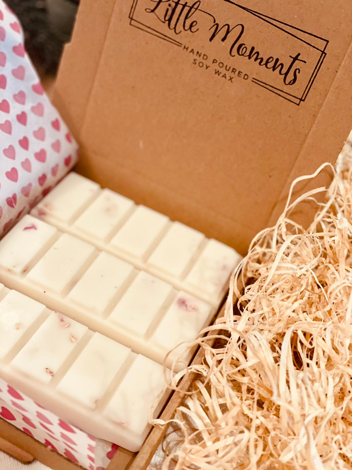 postal box containing three hand poured soy wax melt bars in various fragrances