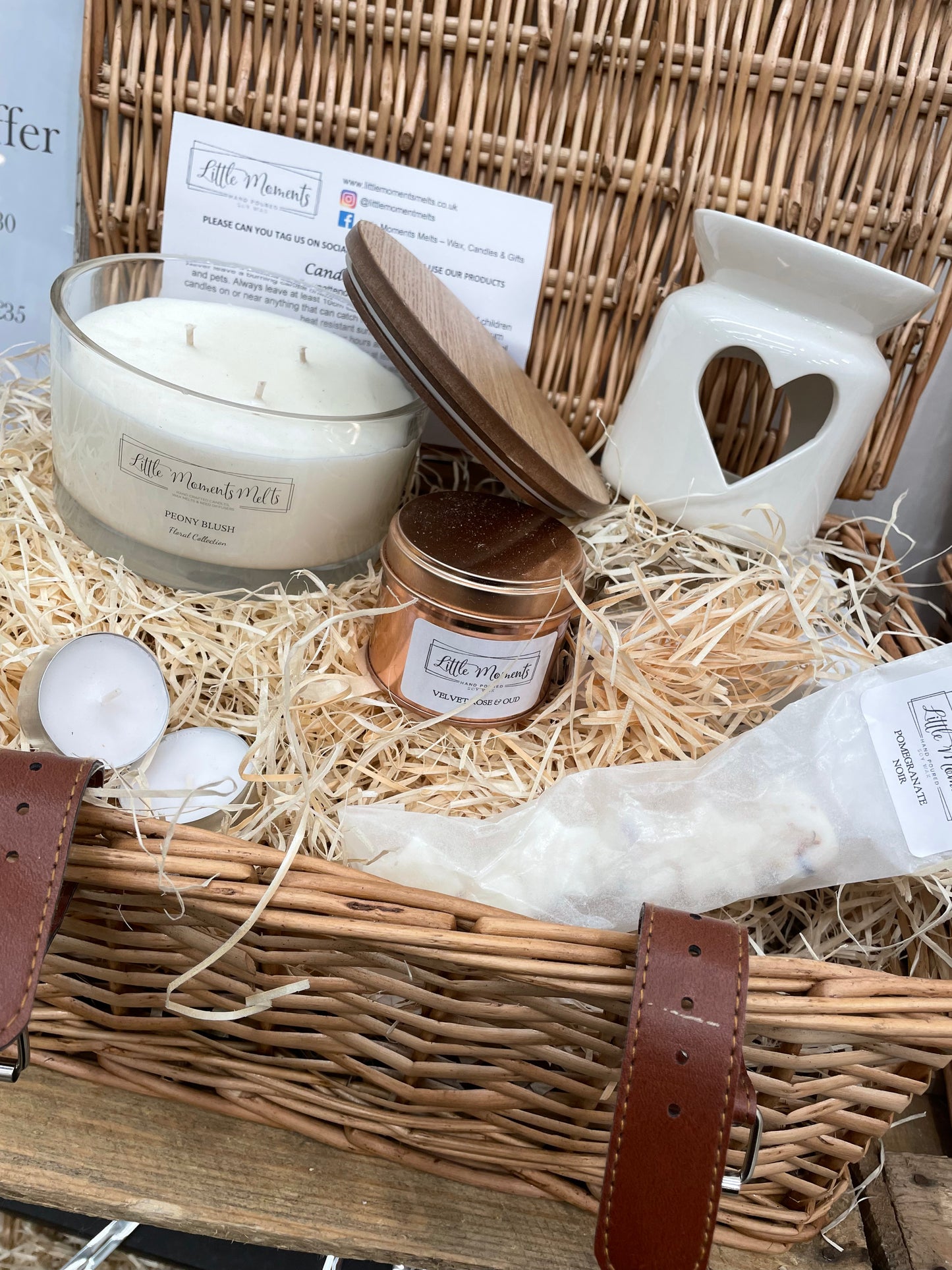 luxury wicker hamper with a triple wick 50cl candle a 20cl candle in a rose gold tin, heart wax melt burner and a pack of wax melts