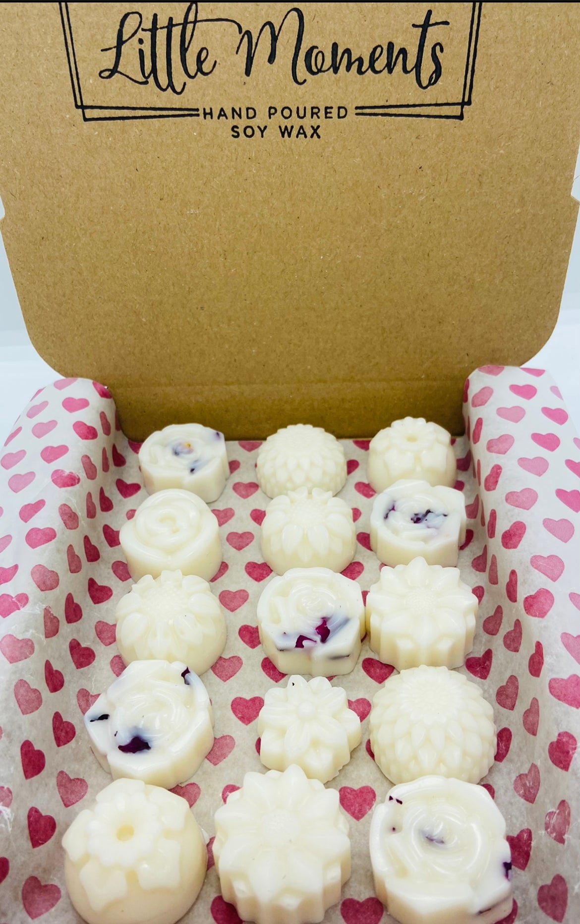 postal box of hand poured soy wax melts in the shape of various flowers available in a wide range of fragrances