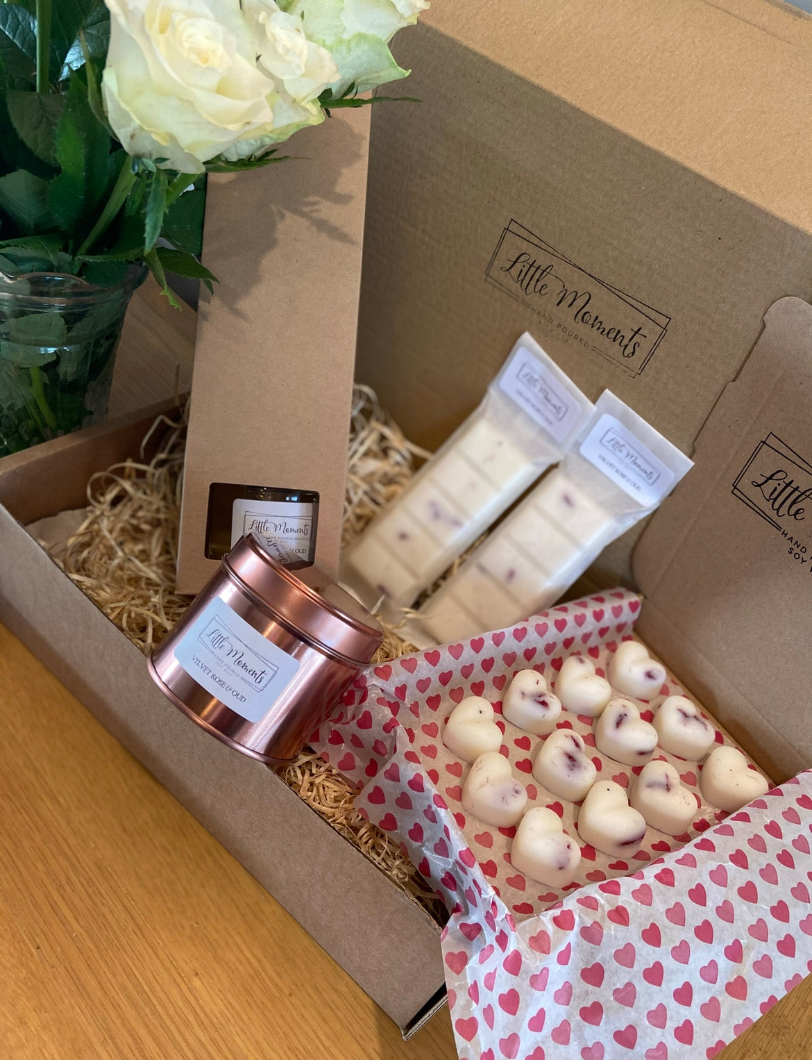 luxury box of home fragrance with a reed diffuser, 2 snap bars of soy wax melts, letterbox of soy wax heart melts, 20cl fragranced candle in a rose gold tin