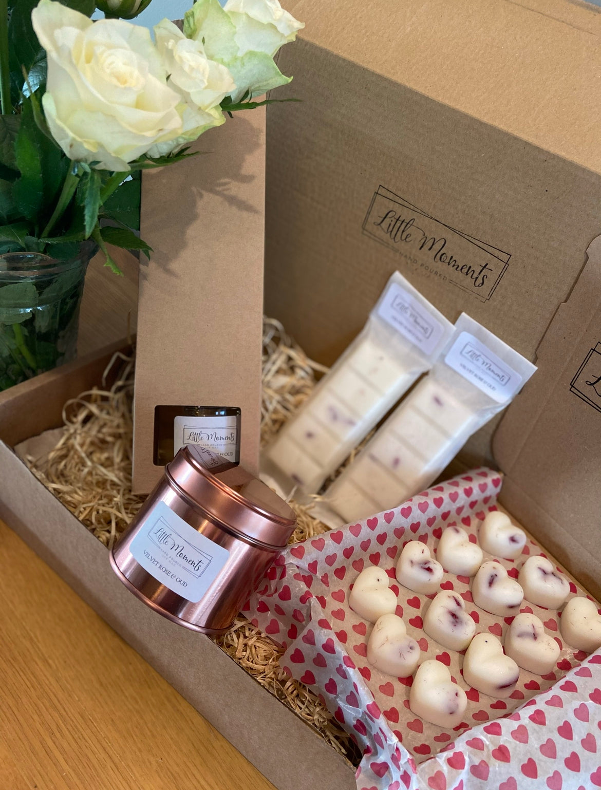 postal box of hand poured soy wax melts in the shape of various flowers available in a wide range of fragrances