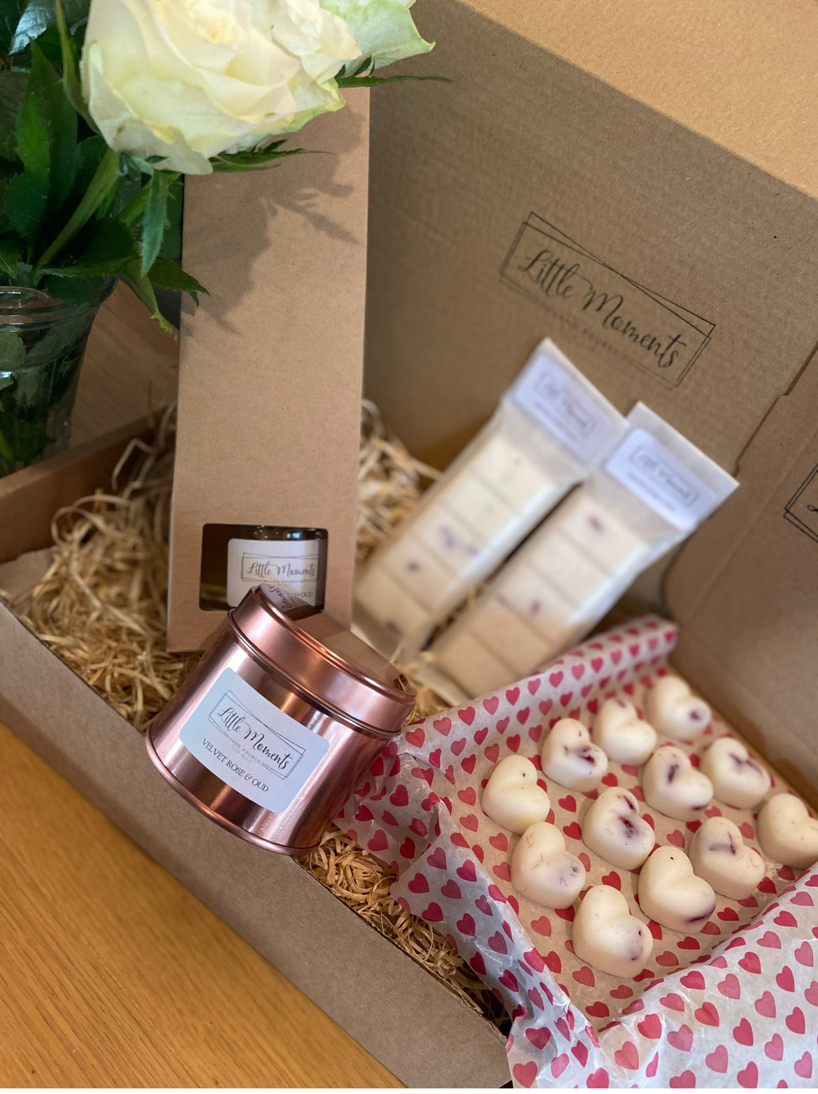 postal box of hand poured soy wax melts in the shape of various flowers available in a wide range of fragrances
