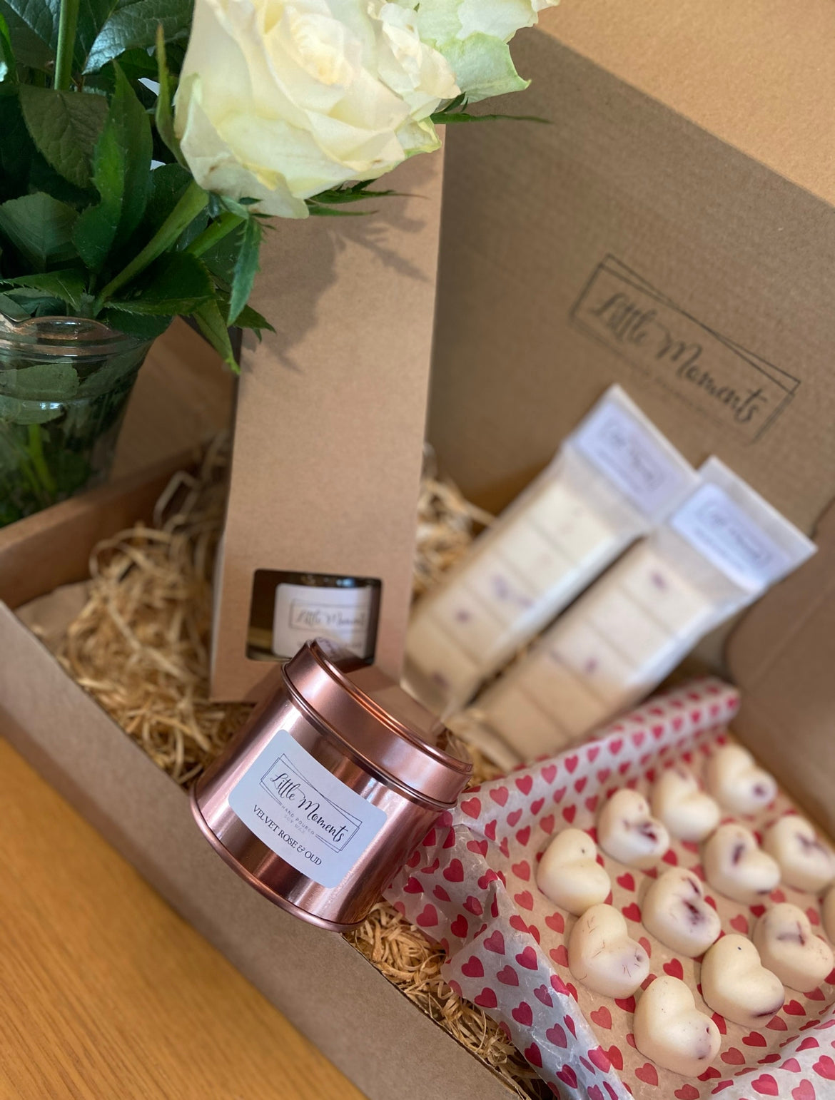 postal box of hand poured soy wax melts in the shape of various flowers available in a wide range of fragrances