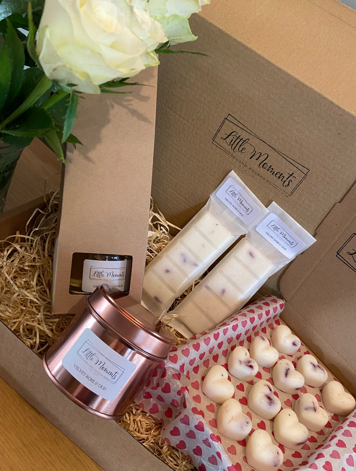 postal box of hand poured soy wax melts in the shape of various flowers available in a wide range of fragrances