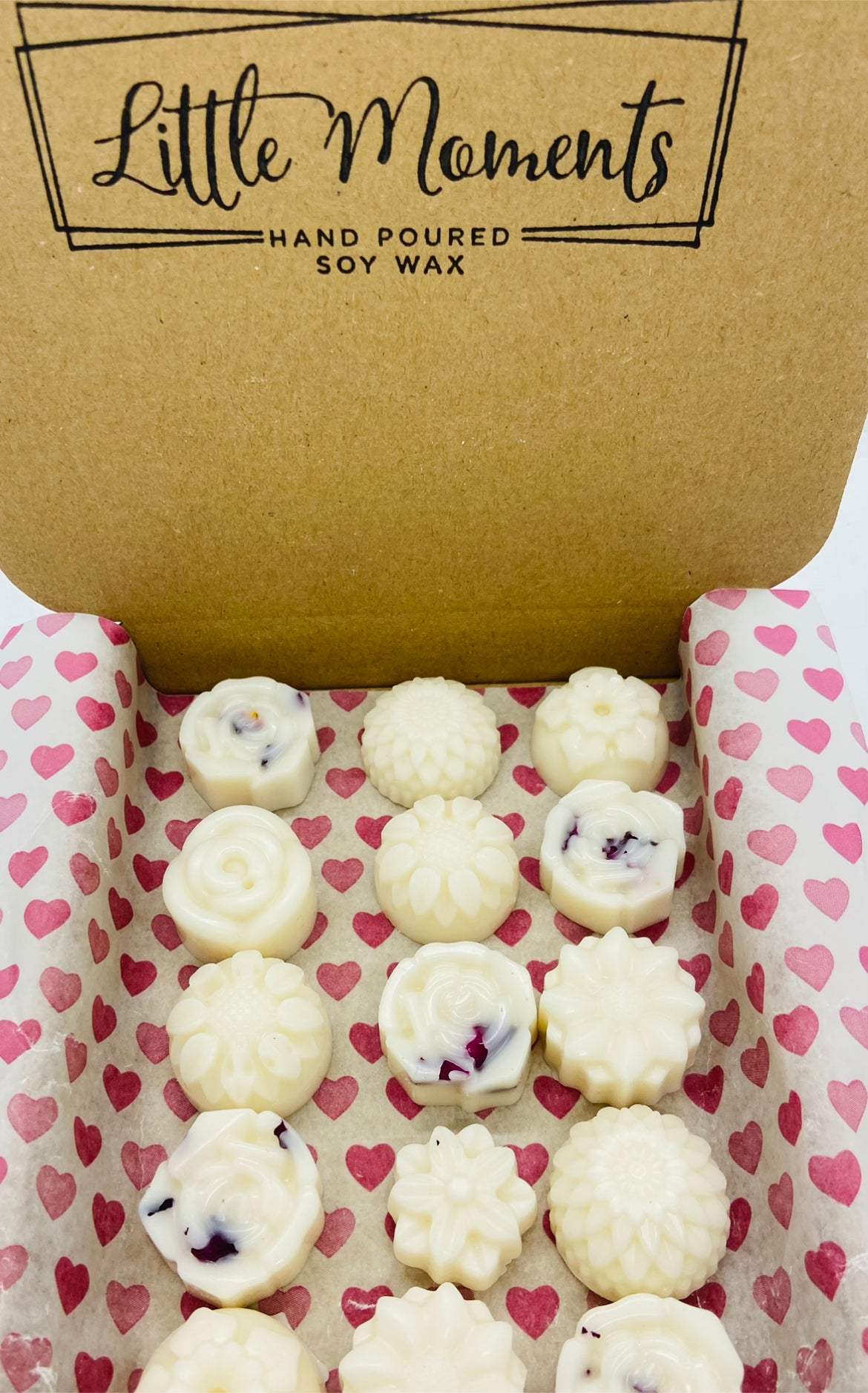 postal box of hand poured soy wax melts in the shape of various flowers available in a wide range of fragrances