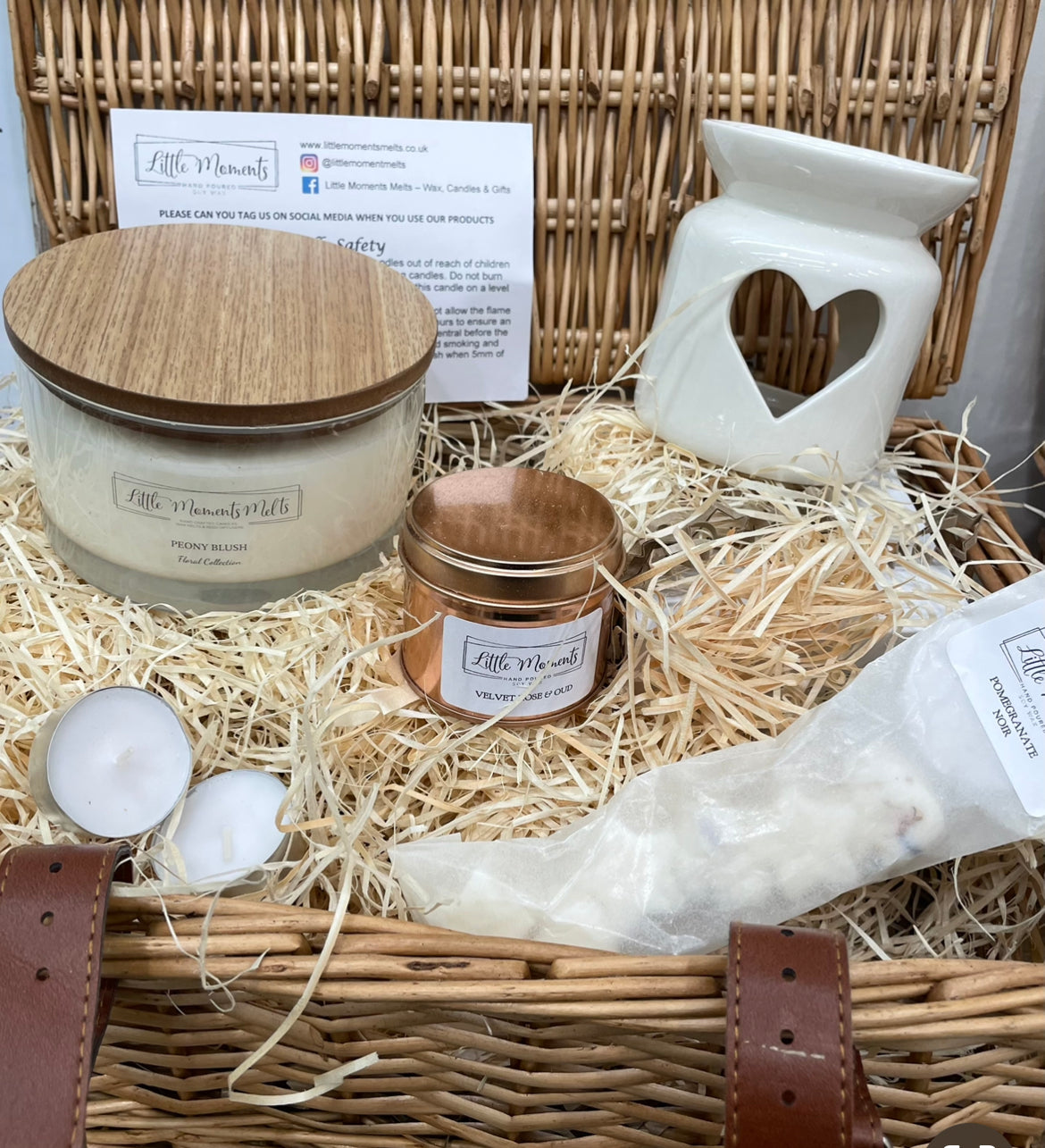 luxury wicker hamper with a triple wick 50cl candle a 20cl candle in a rose gold tin, heart wax melt burner and a pack of wax melts